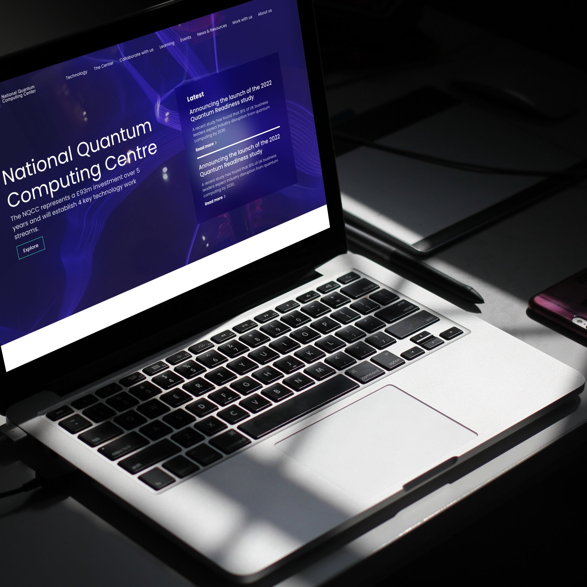 Laptop displaying homepage of National Quantum Computing Centre (NQCC) B2B web design, built bespoke and responsive on Wordpress CMS