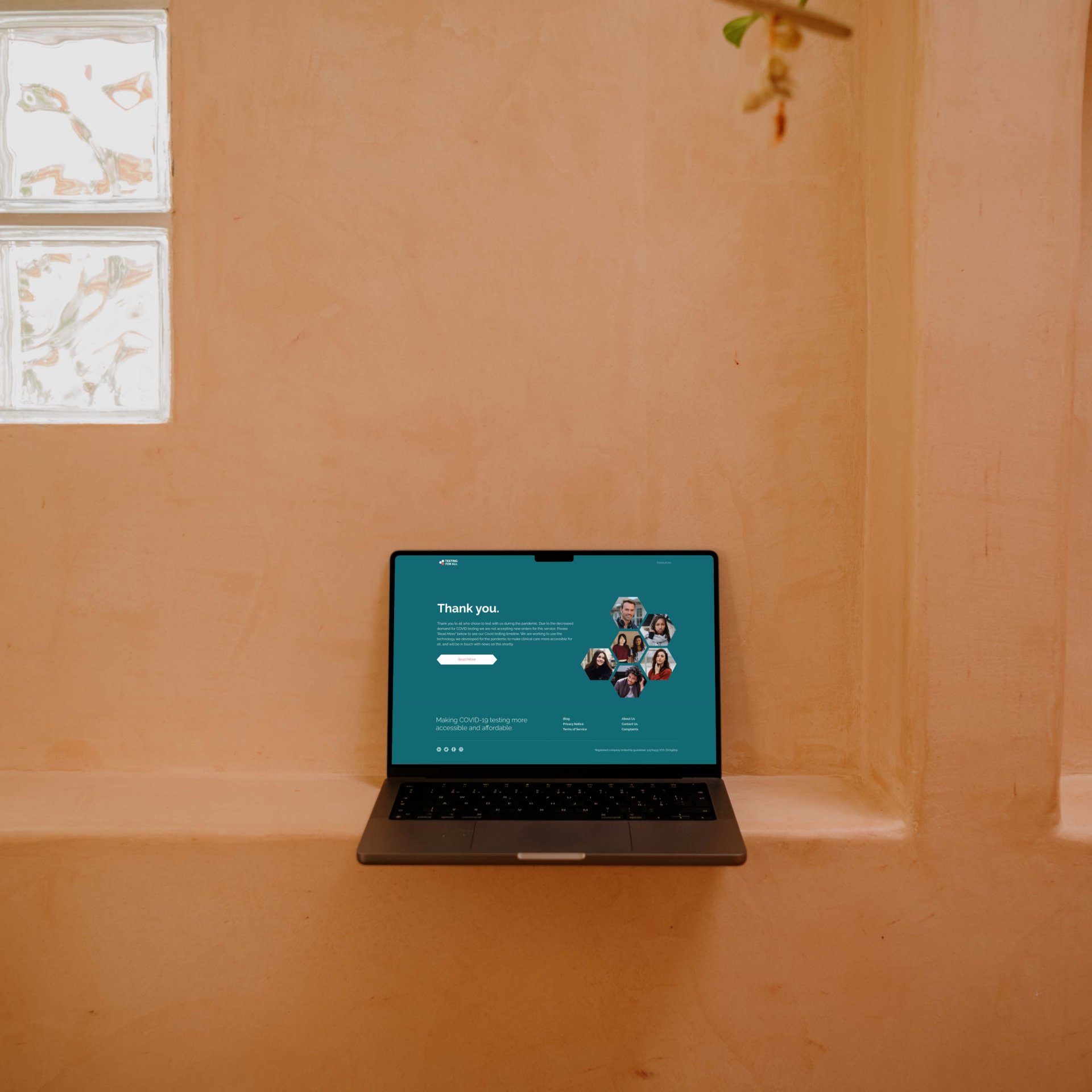 Laptop displaying Testing for All website, ready for launch of new digital advertising campaign