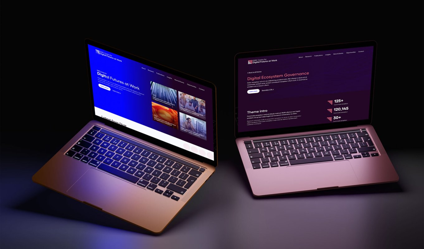Two laptops displaying the Digit website