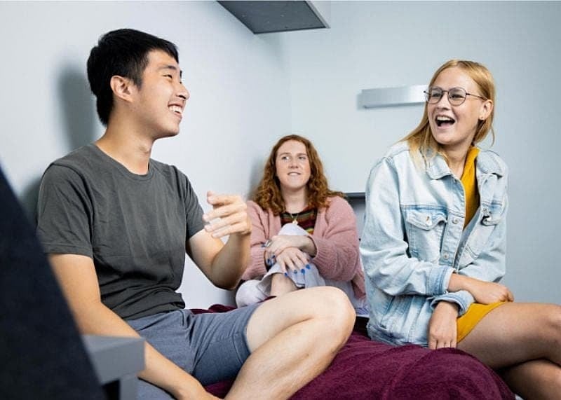 Students laughing and smiling together