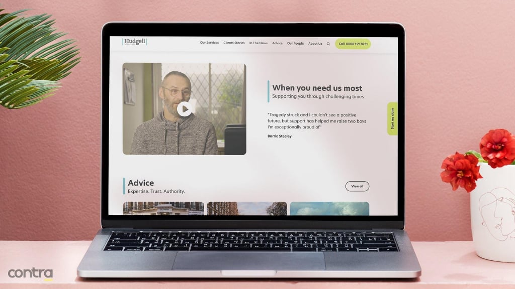 Laptop displaying client video review on Hudgell Solicitors' web design