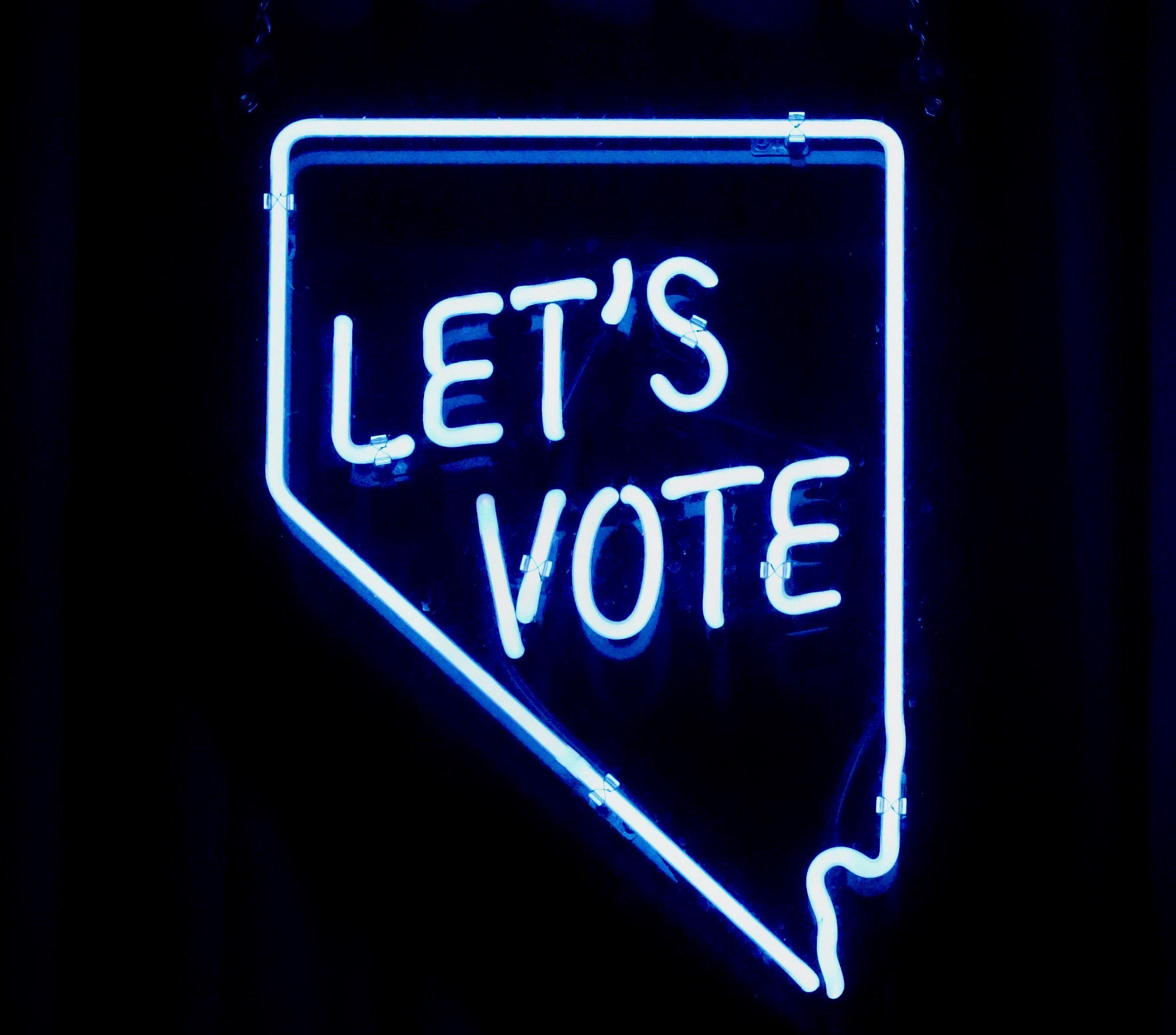 Image showing a neon sign that says Let's Vote